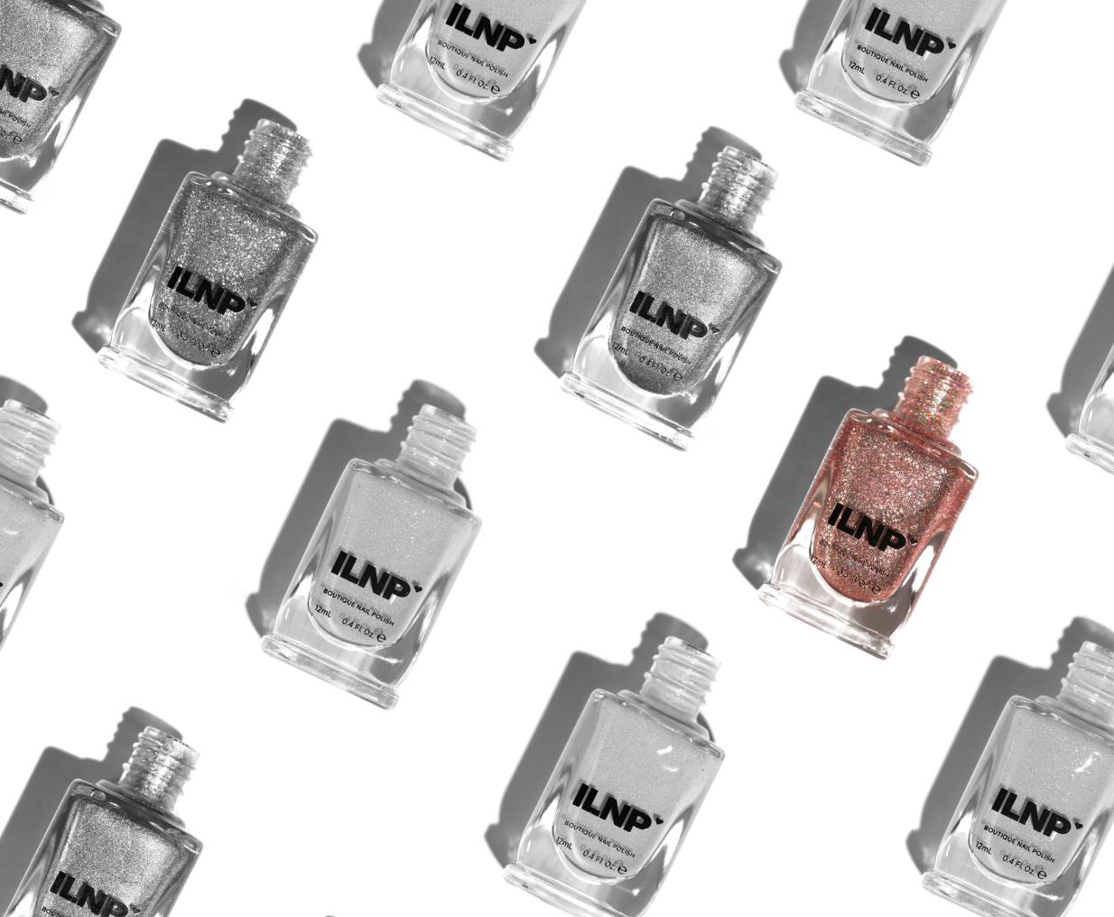 A pattern of silver ILNP nail polish bottles with a single rose-gold bottle standing out